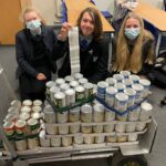 Students pose with just a small number of the donations made over Christmas