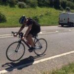 Frankie cycling during his Triathlon